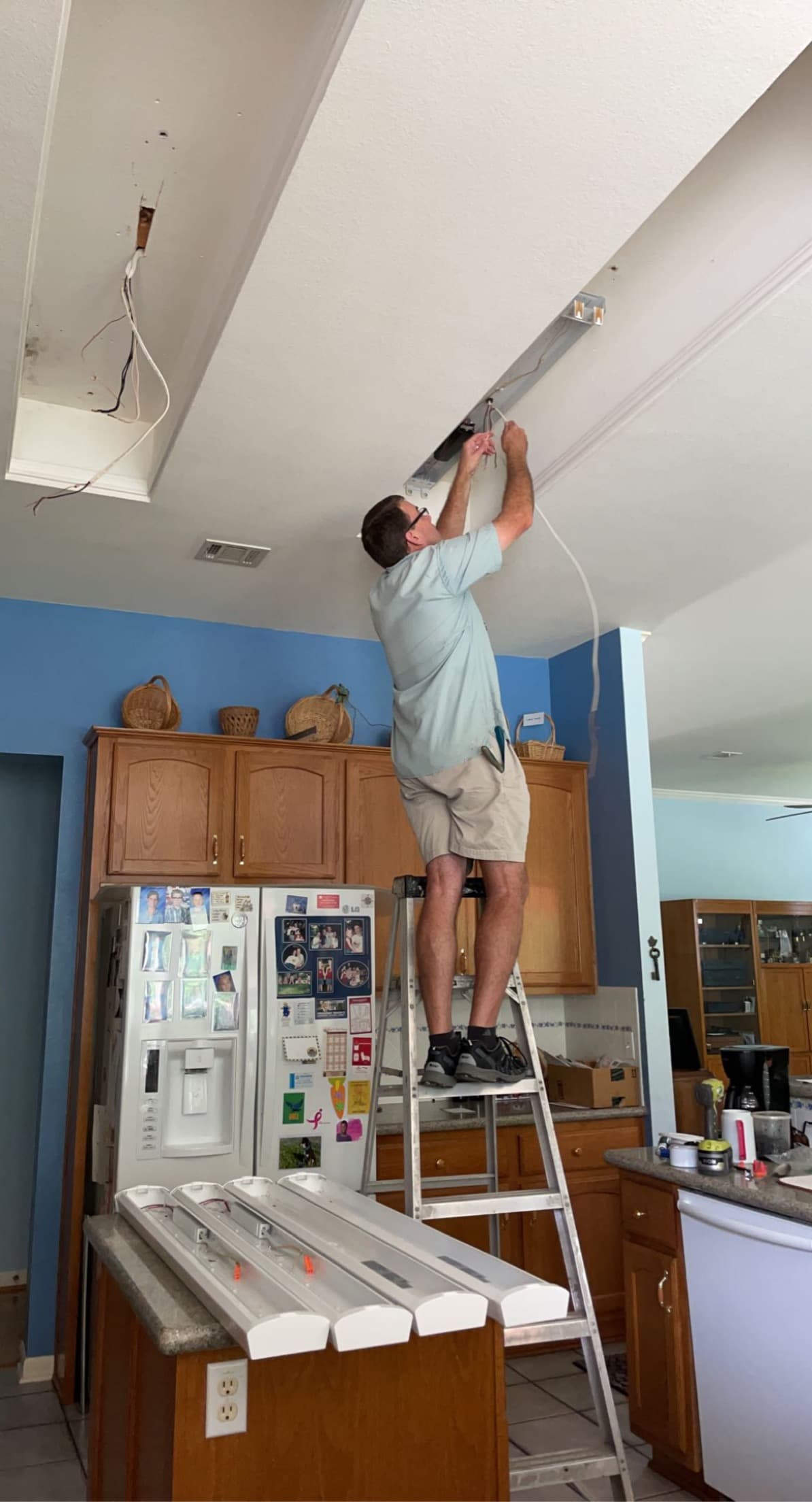 Kevin installing light fixtures