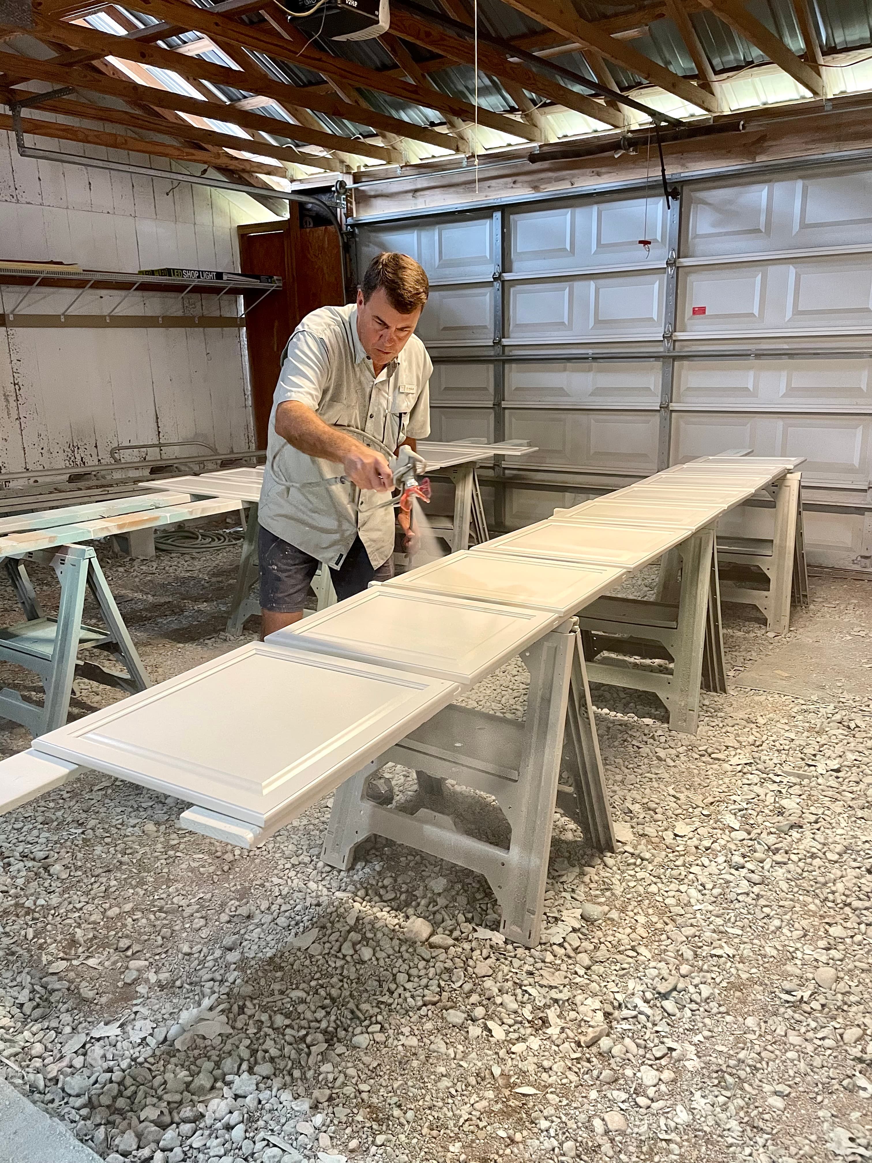 Kevin spraying cabinets